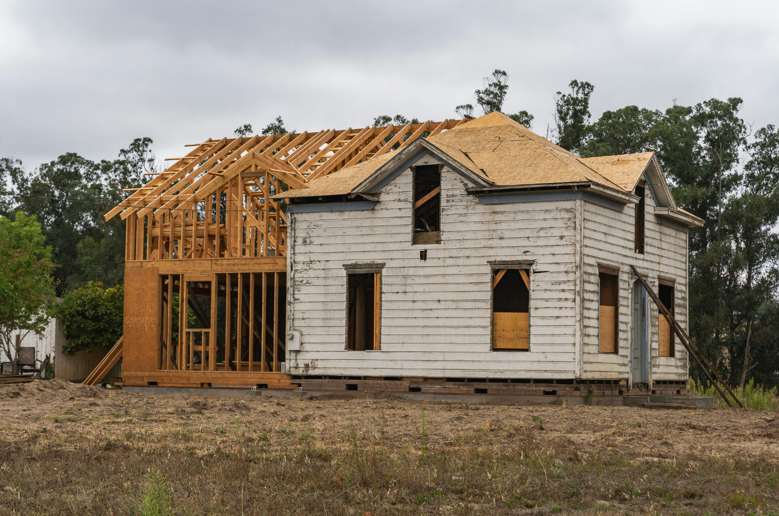 house framing under construction in cloudy weather