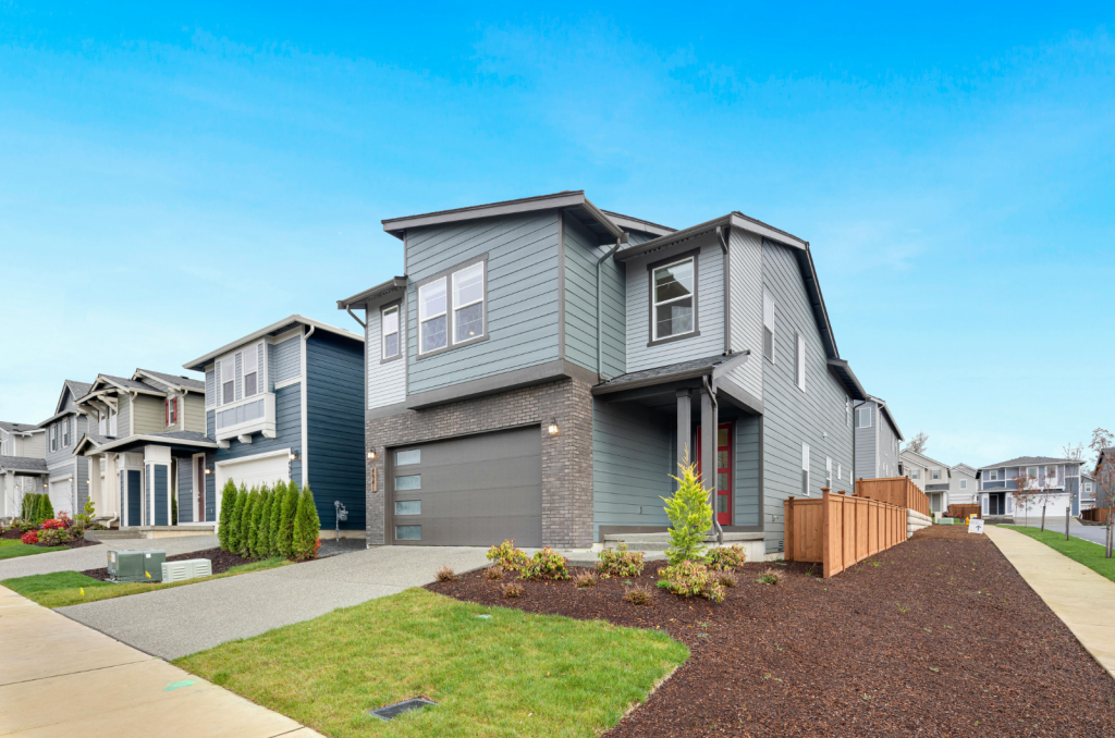 Stylish contemporary house with spacious driveway and landscaped exterior