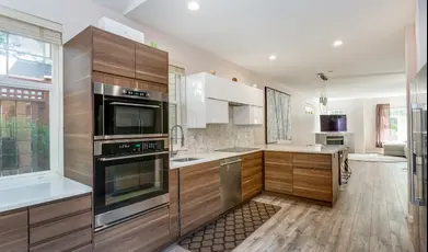 Modern kitchen with wood cabinets and island