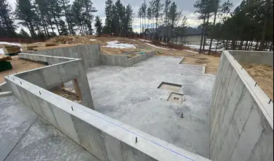 Concrete foundation with basement layout under construction