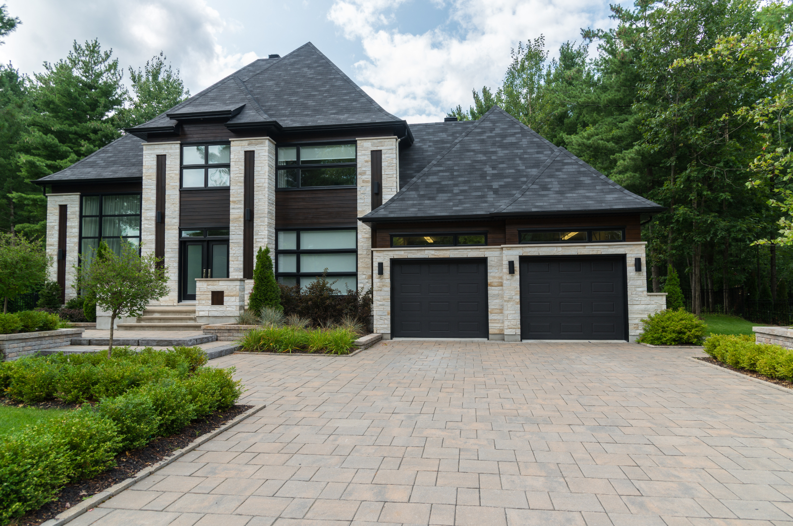 Modern luxury home with stone facade and double garage